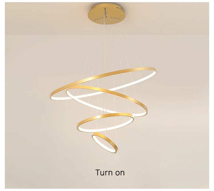 Modern LED ring chandelier suspended above a dining table in a luxury contemporary home.
