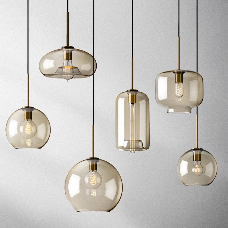 Nordic glass pendant light suspended above a kitchen island in a modern Scandinavian-inspired home.