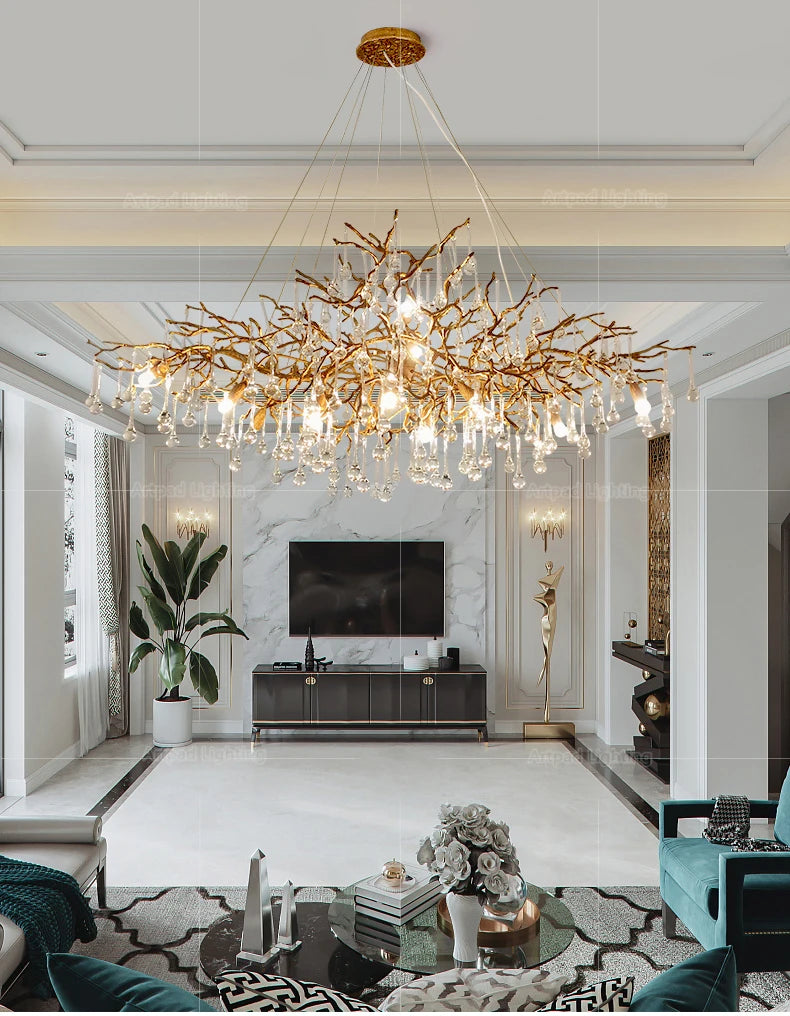 Luxury gold branch crystal chandelier hanging in a modern living room with elegant contemporary décor.