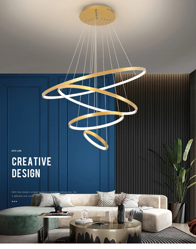 Modern LED ring chandelier suspended above a dining table in a luxury contemporary home.