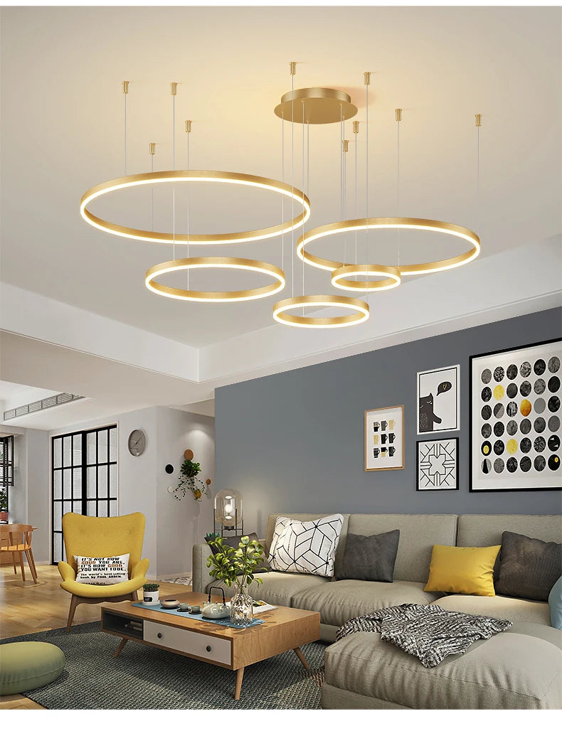Modern LED circular ring chandelier installed above a dining table in a contemporary luxury home.