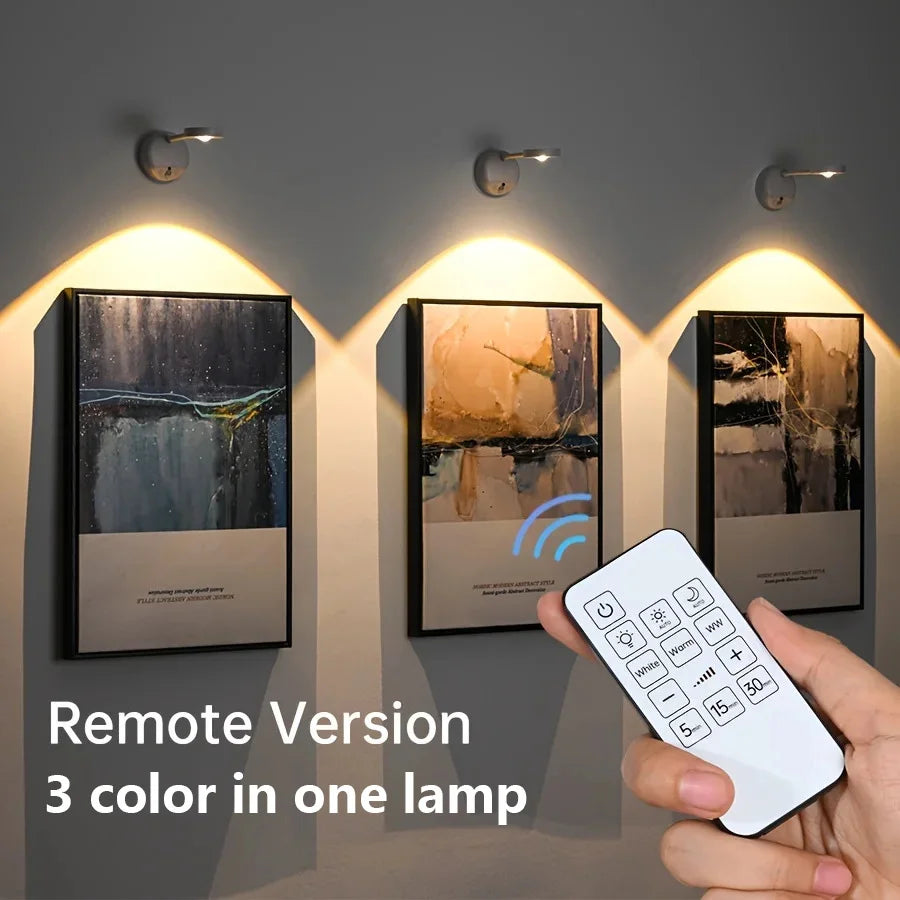 Rechargeable motion sensor LED wall light illuminating a framed artwork in a modern living room.