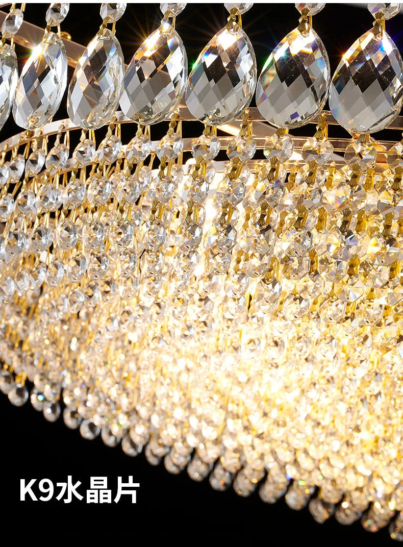 Luxury gold crystal LED chandelier hanging in an elegant modern living room with premium interior décor.