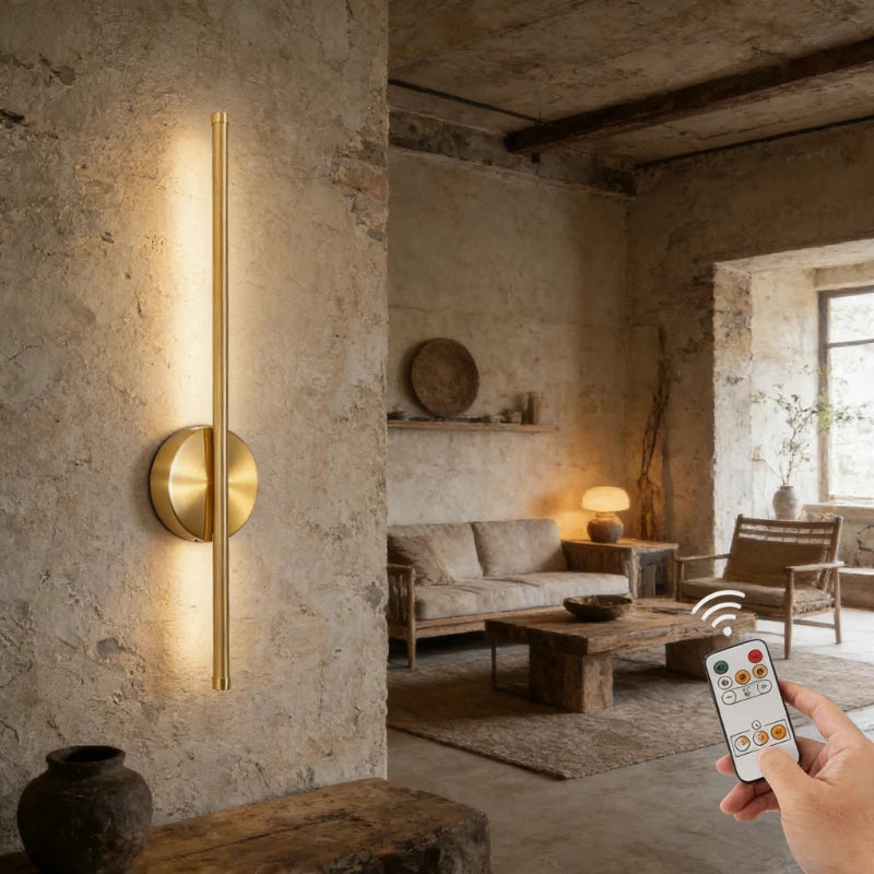 Wireless rechargeable LED wall sconce with remote control mounted beside a modern bedroom bed.