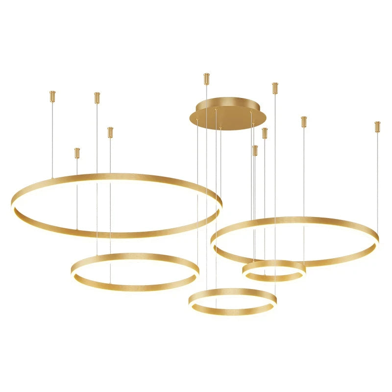 Modern LED circular ring chandelier installed above a dining table in a contemporary luxury home.