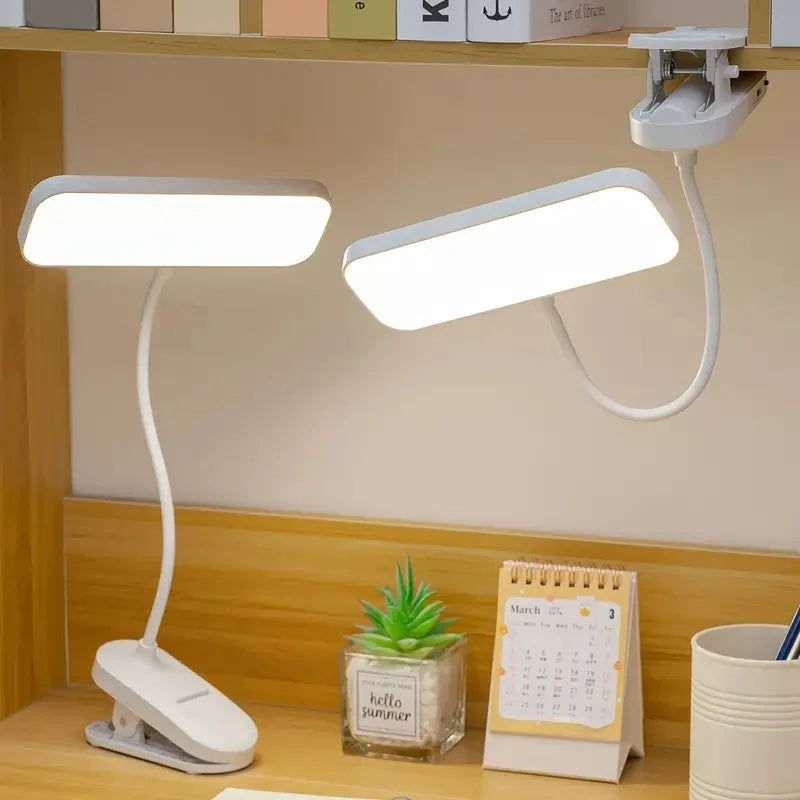Rechargeable LED clip-on desk lamp attached to a study desk for reading and office work.