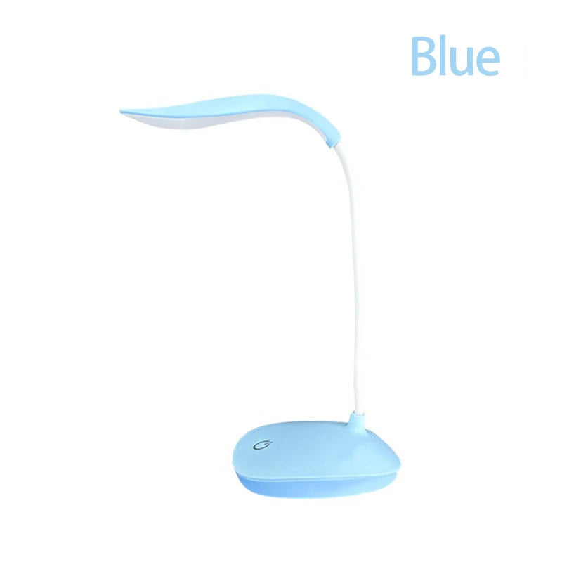 Modern LED eye care desk lamp with USB charging and touch dimming on a study desk.