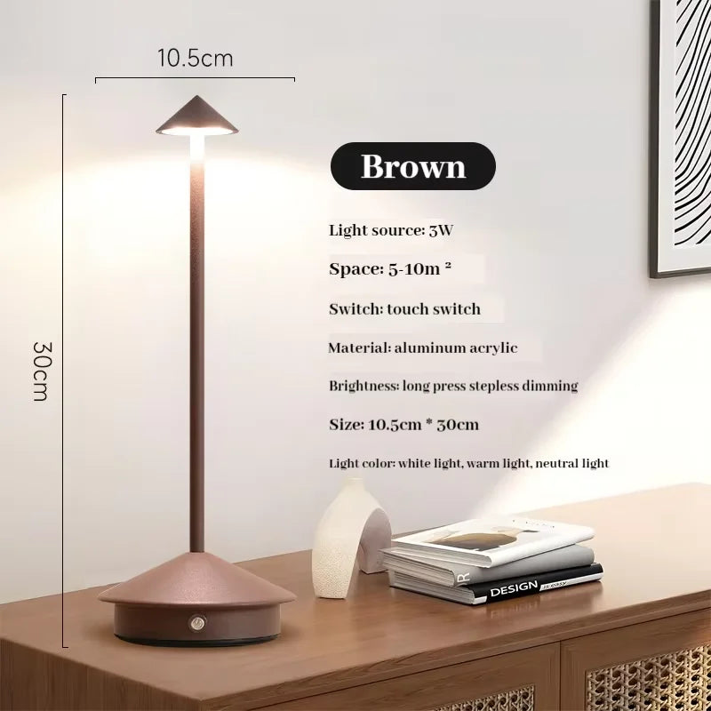 Rechargeable touch LED table lamp placed on a modern dining table in a stylish café-inspired interior.