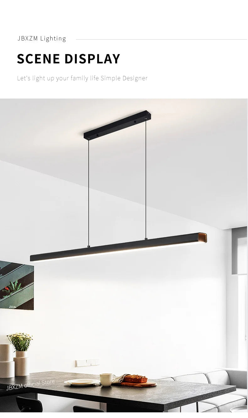 Modern linear LED pendant light suspended above a dining table in a contemporary dining room.