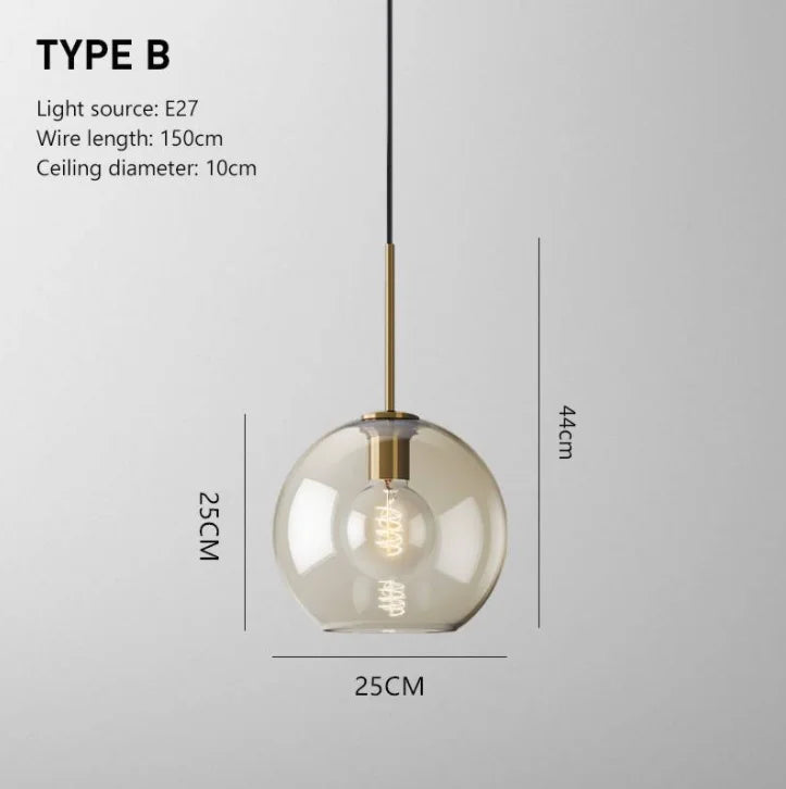 Nordic glass pendant light suspended above a kitchen island in a modern Scandinavian-inspired home.