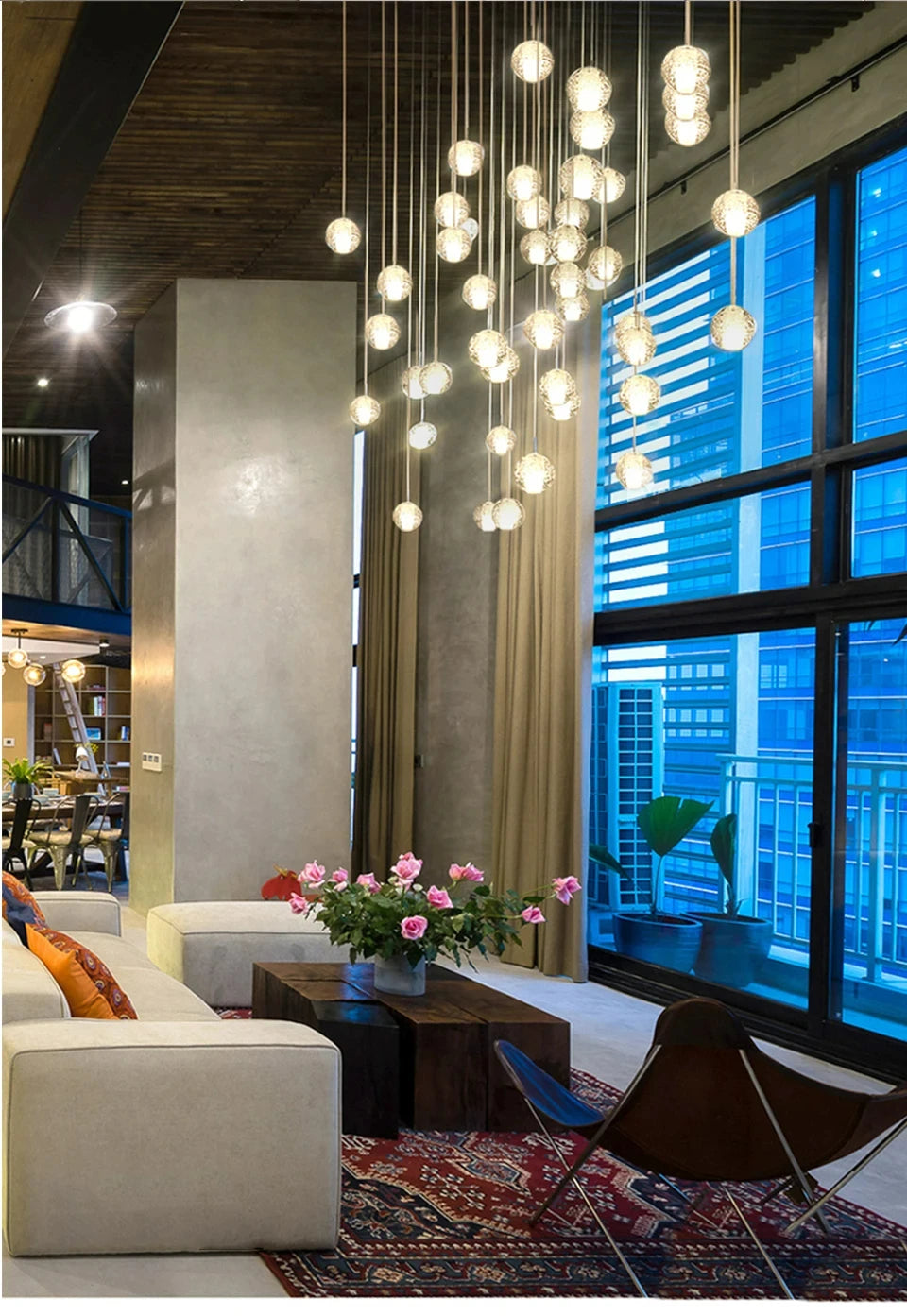 Modern spiral crystal LED chandelier cascading down a luxury staircase in a contemporary home.