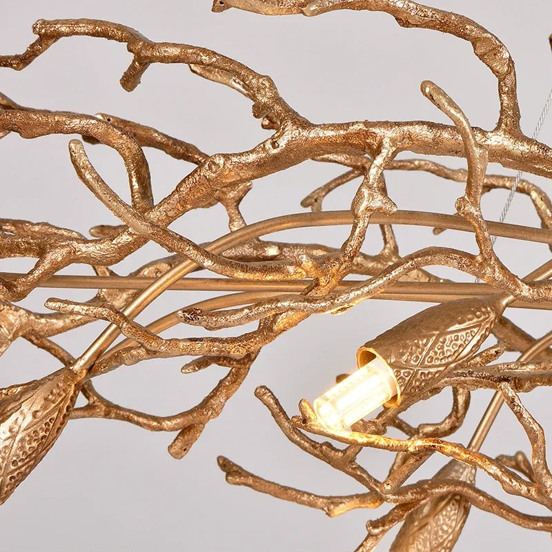 Luxury gold branch crystal chandelier hanging in a modern living room with elegant contemporary décor.