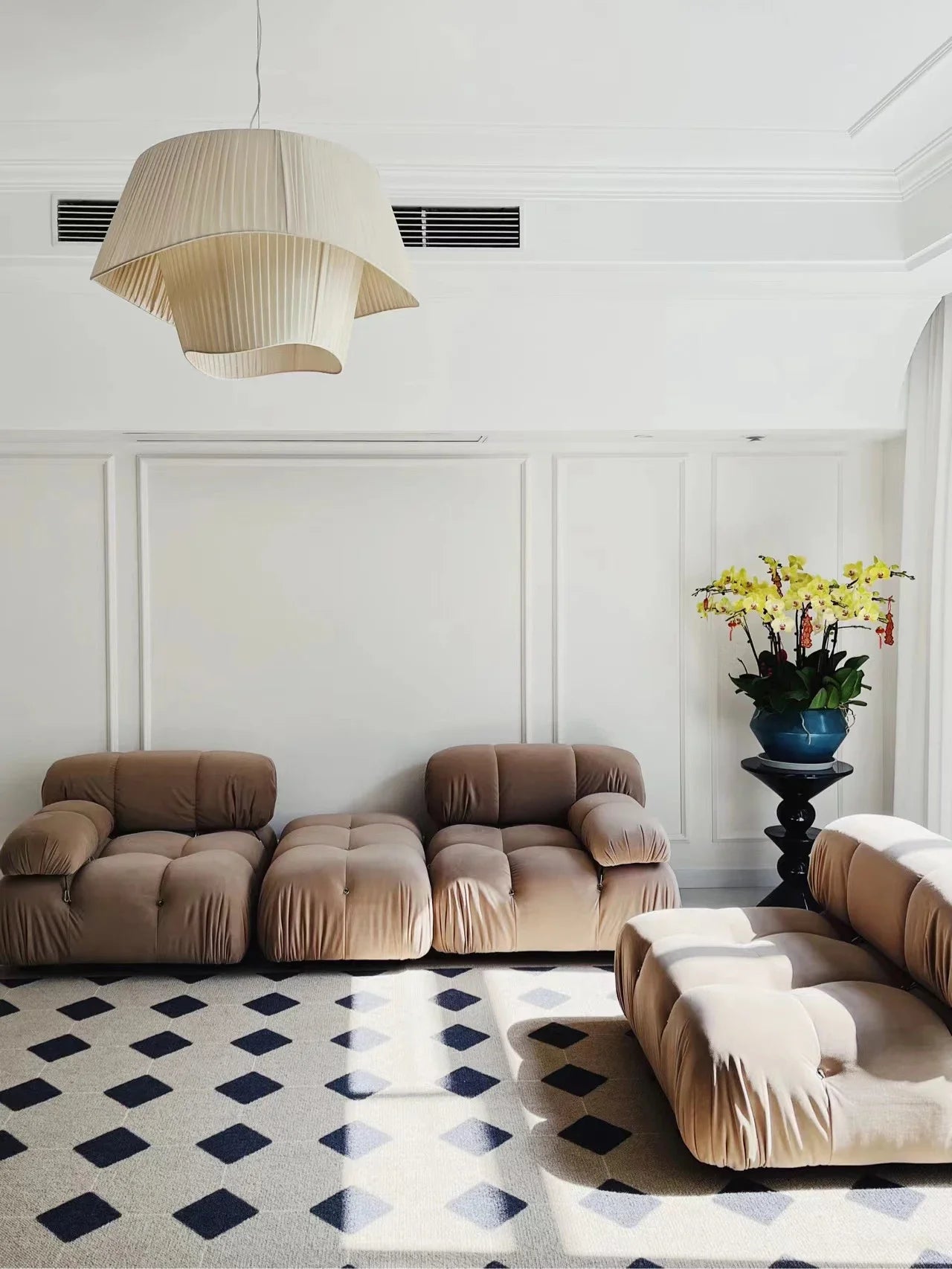Nordic modern LED pendant light hanging above a dining table in a contemporary living room.