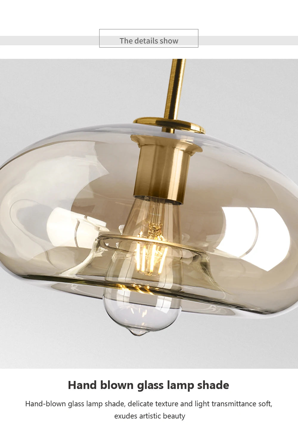 Nordic glass pendant light suspended above a kitchen island in a modern Scandinavian-inspired home.
