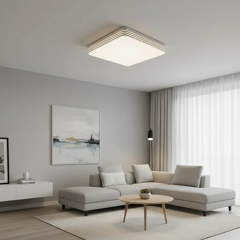 Modern square LED ceiling light installed in a contemporary living room with bright energy-efficient lighting.