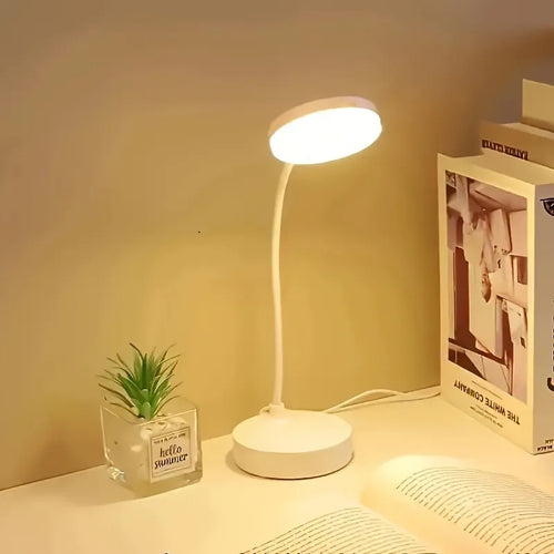 Flexible LED desk lamp with adjustable neck and 3-level dimmer on a modern study desk.
