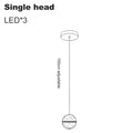 Modern spiral crystal LED chandelier cascading down a luxury staircase in a contemporary home.