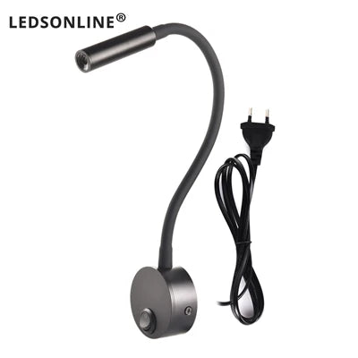 Modern LED wall reading light mounted beside a bed, providing focused lighting for reading.