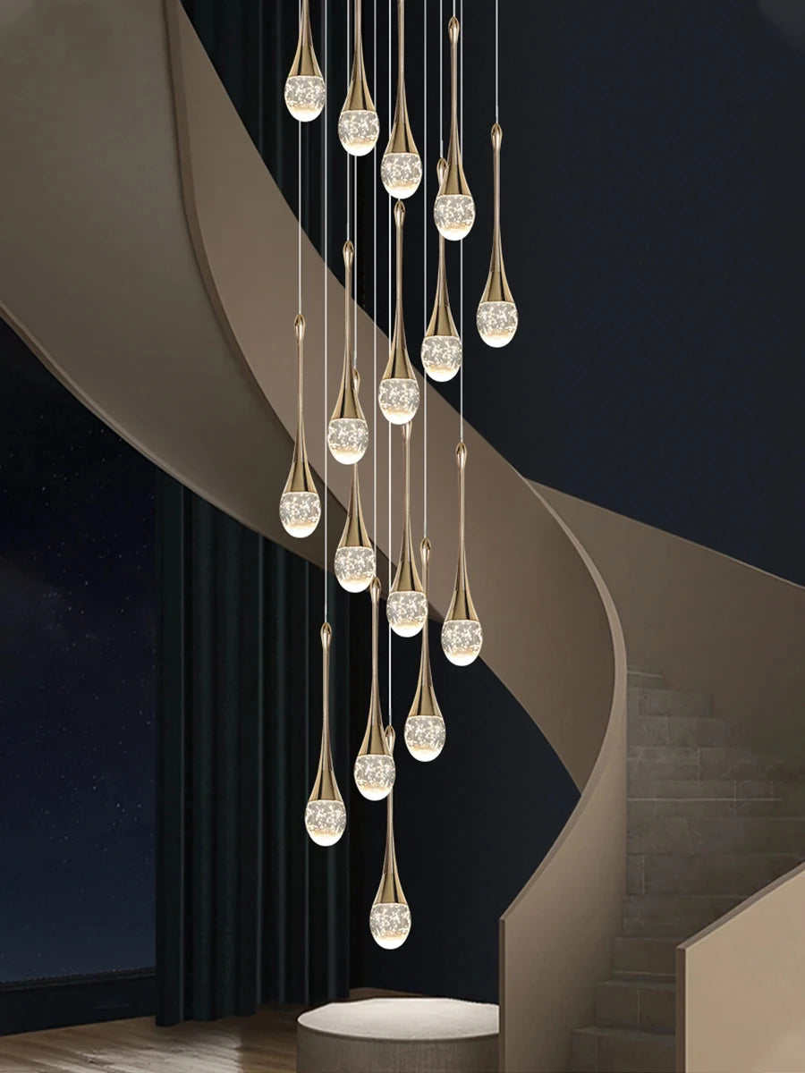 Modern bubble crystal pendant light hanging above a kitchen island in a luxury contemporary home.
