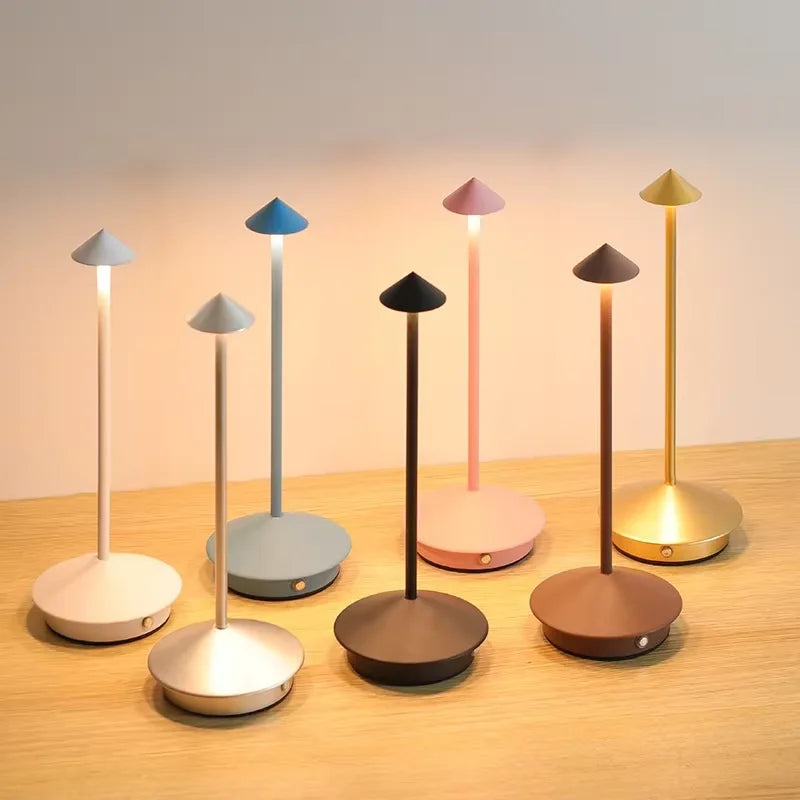 Rechargeable touch LED table lamp placed on a modern dining table in a stylish café-inspired interior.