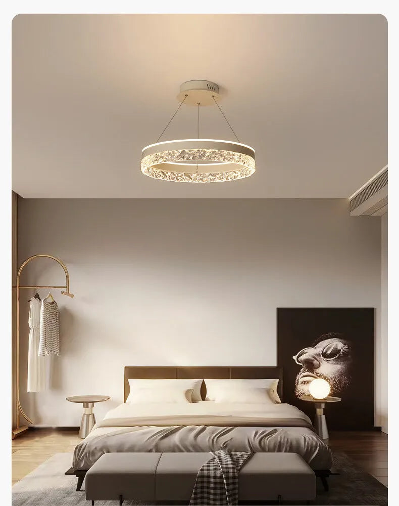 Modern luxe LED ring chandelier suspended in a contemporary living room with elegant minimalist décor.