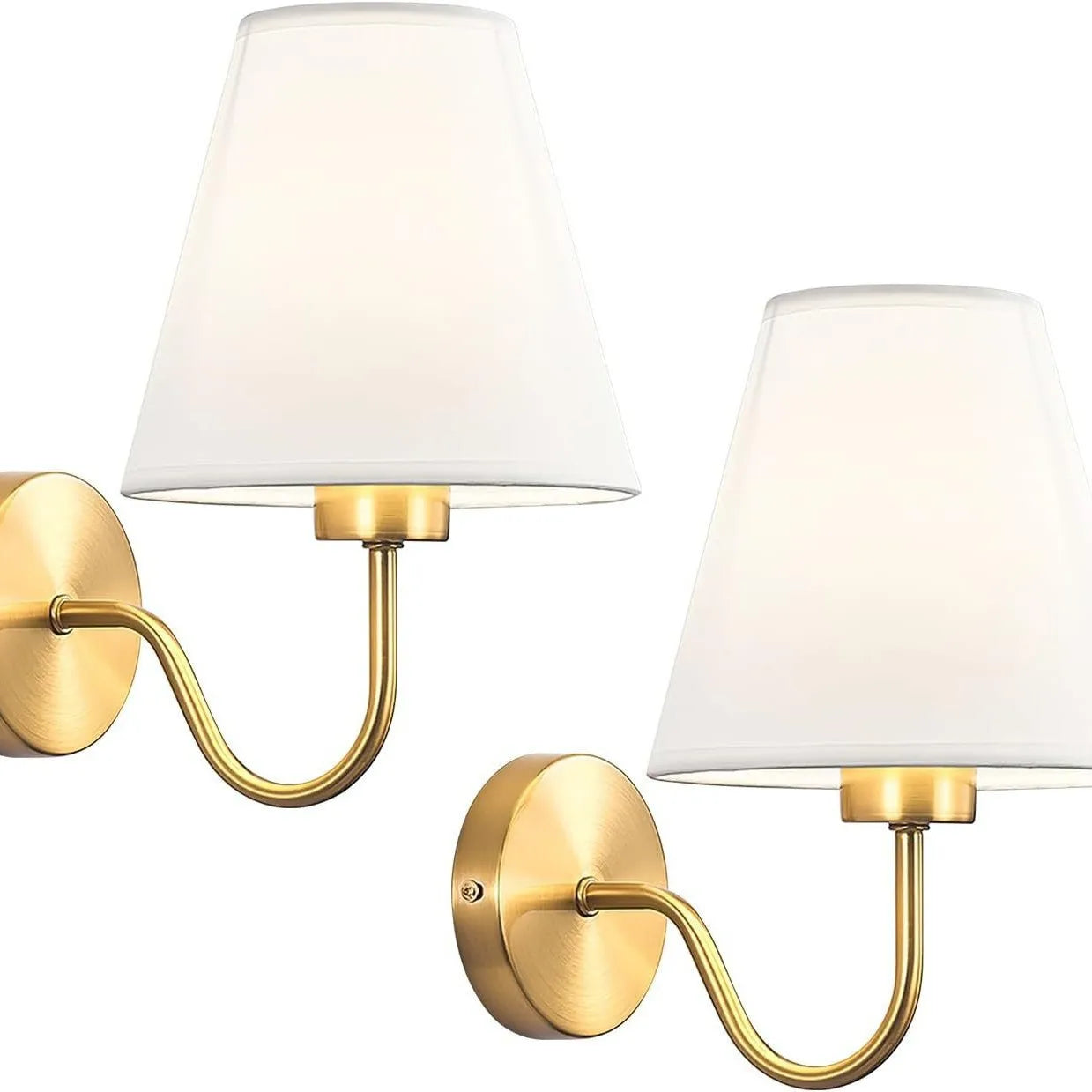 Modern fabric wall sconce installed beside a bed in a contemporary bedroom with warm ambient lighting.
