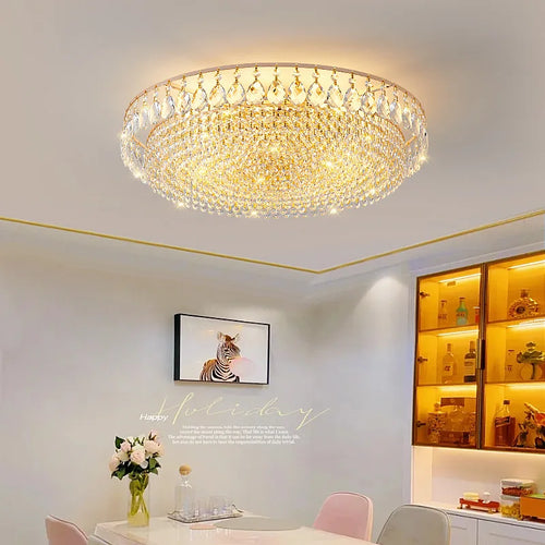 Luxury gold crystal LED chandelier hanging in an elegant modern living room with premium interior décor.