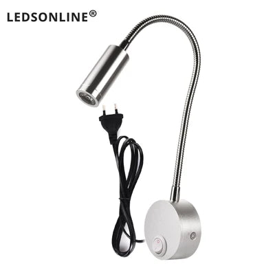 Modern LED wall reading light mounted beside a bed, providing focused lighting for reading.