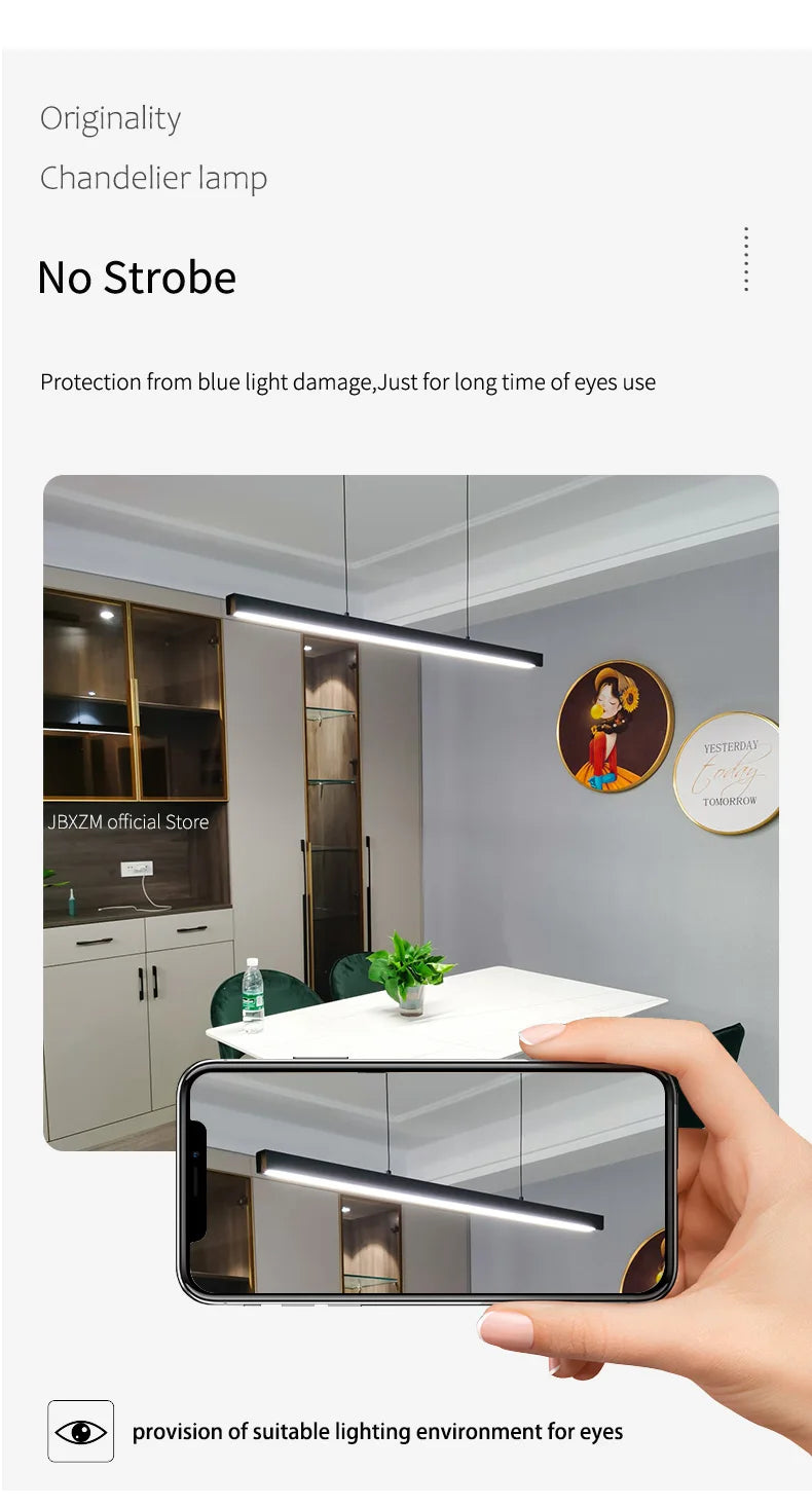 Modern linear LED pendant light suspended above a dining table in a contemporary dining room.
