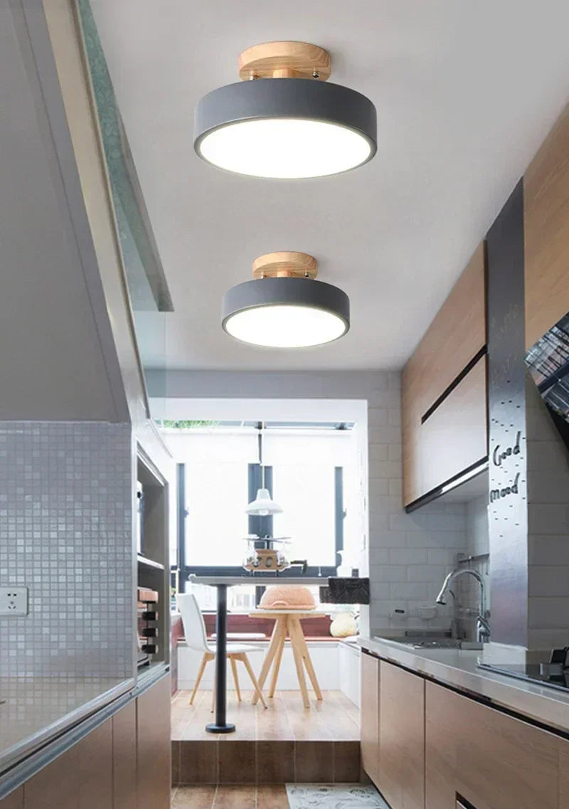 Nordic wood round LED ceiling light installed in a modern hallway with Scandinavian-inspired interior décor.