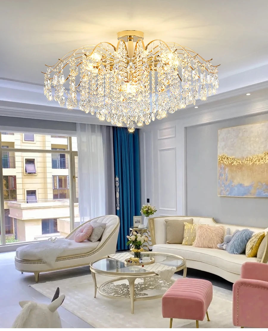 Modern luxury crystal LED chandelier installed in a stylish living room with elegant contemporary décor.