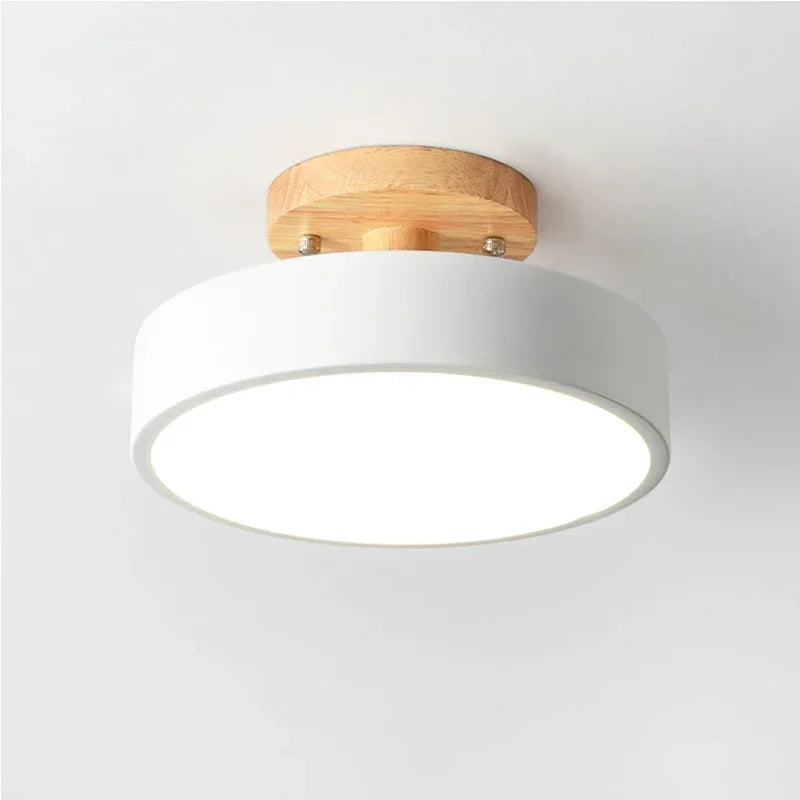 Nordic wood round LED ceiling light installed in a modern hallway with Scandinavian-inspired interior décor.