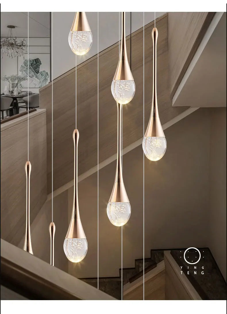 Modern bubble crystal pendant light hanging above a kitchen island in a luxury contemporary home.