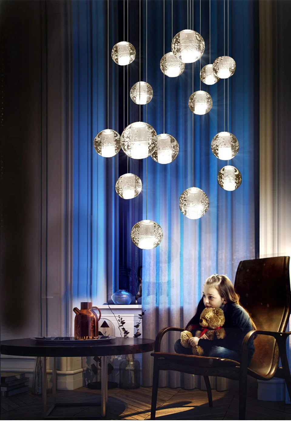 Modern spiral crystal LED chandelier cascading down a luxury staircase in a contemporary home.