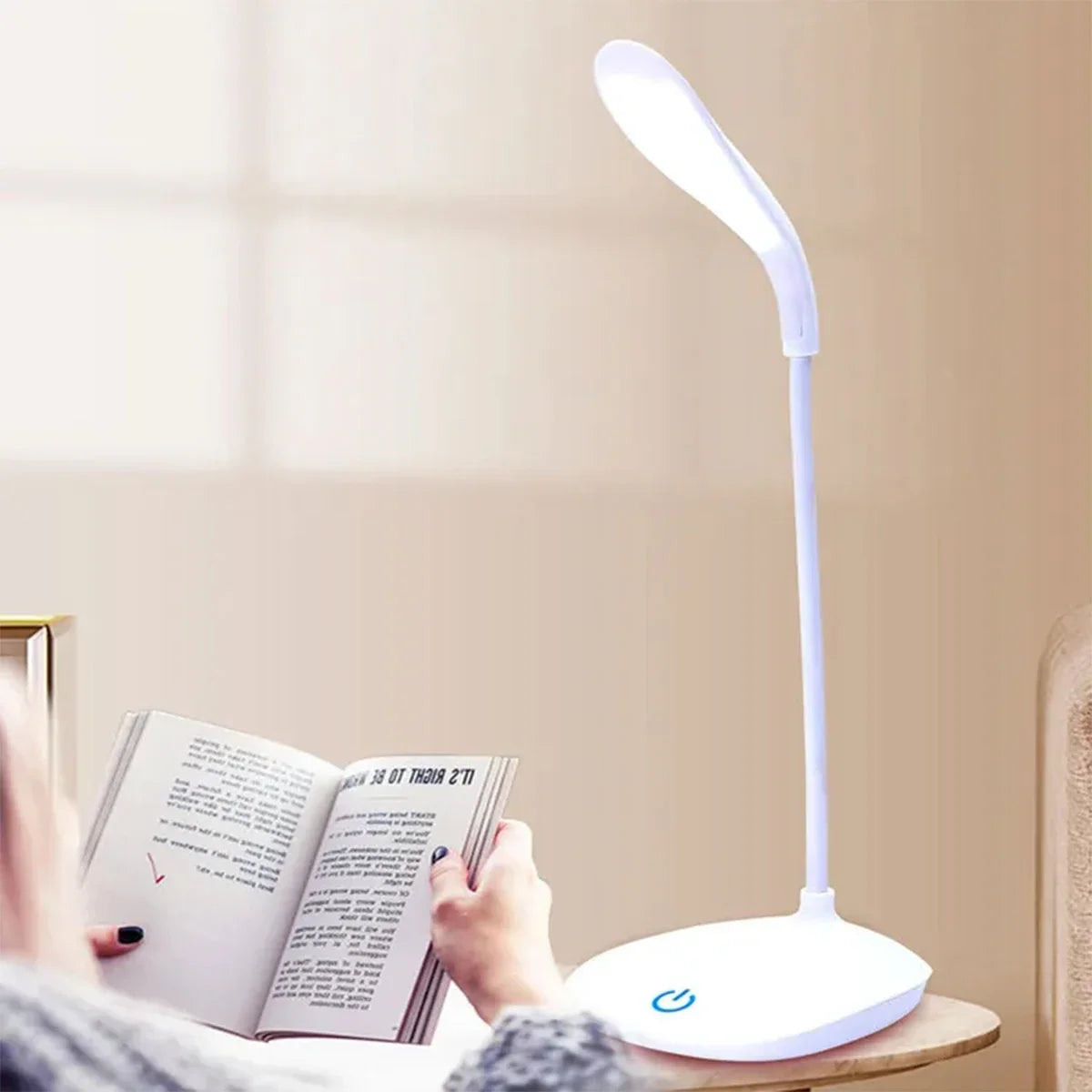 Modern LED eye care desk lamp with USB charging and touch dimming on a study desk.