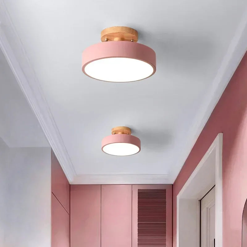 Nordic wood round LED ceiling light installed in a modern hallway with Scandinavian-inspired interior décor.