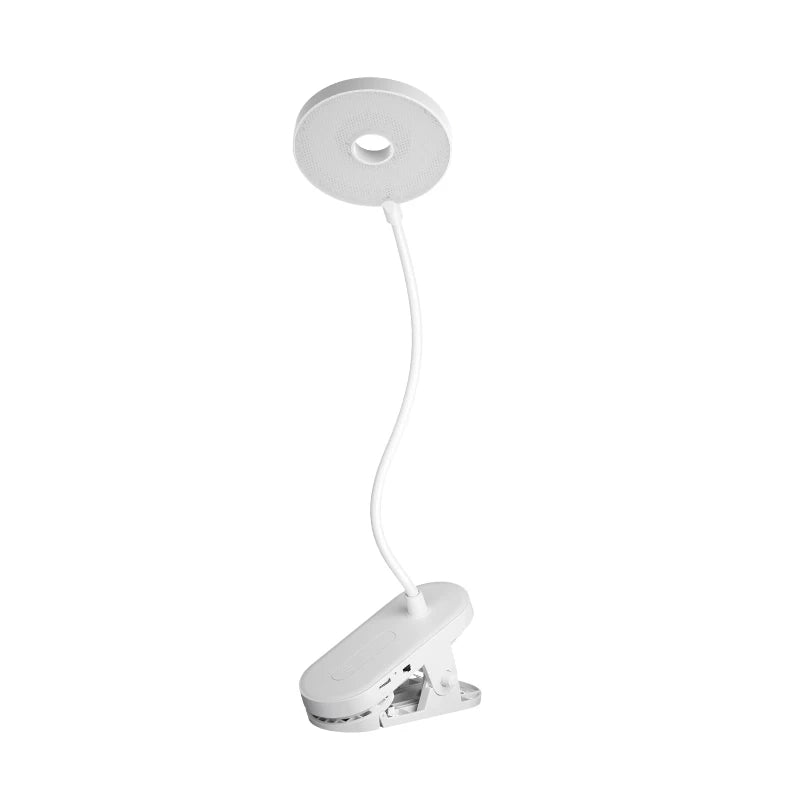 Modern LED eye care desk lamp with USB charging and touch dimming on a study desk.