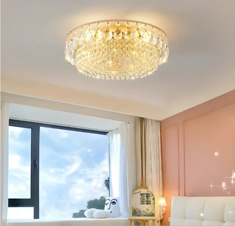 Luxury gold crystal LED chandelier hanging in an elegant modern living room with premium interior décor.