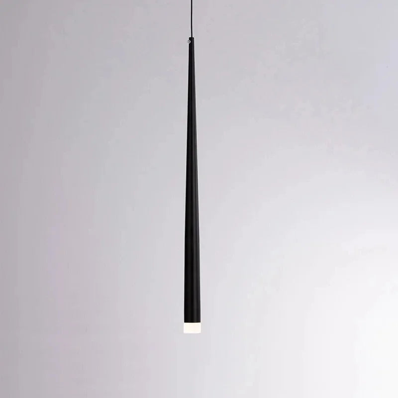 Modern cone LED pendant light hanging above a kitchen island in a contemporary home.