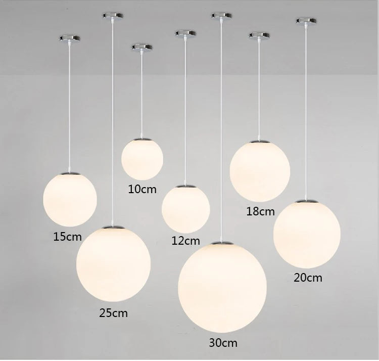 Modern Glass Globe Pendant Light in various sizes for stylish lighting in dining room, kitchen, and bar decor. E27 base type.