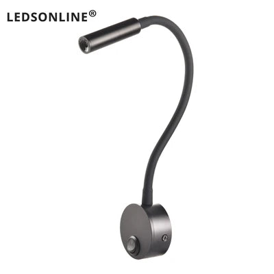 Modern LED wall reading light mounted beside a bed, providing focused lighting for reading.