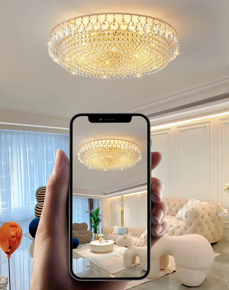 Luxury gold crystal LED chandelier hanging in an elegant modern living room with premium interior décor.