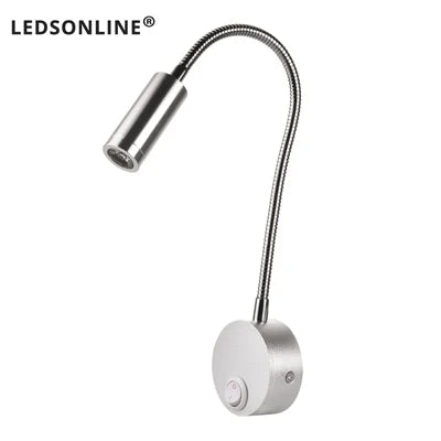 Modern LED wall reading light mounted beside a bed, providing focused lighting for reading.
