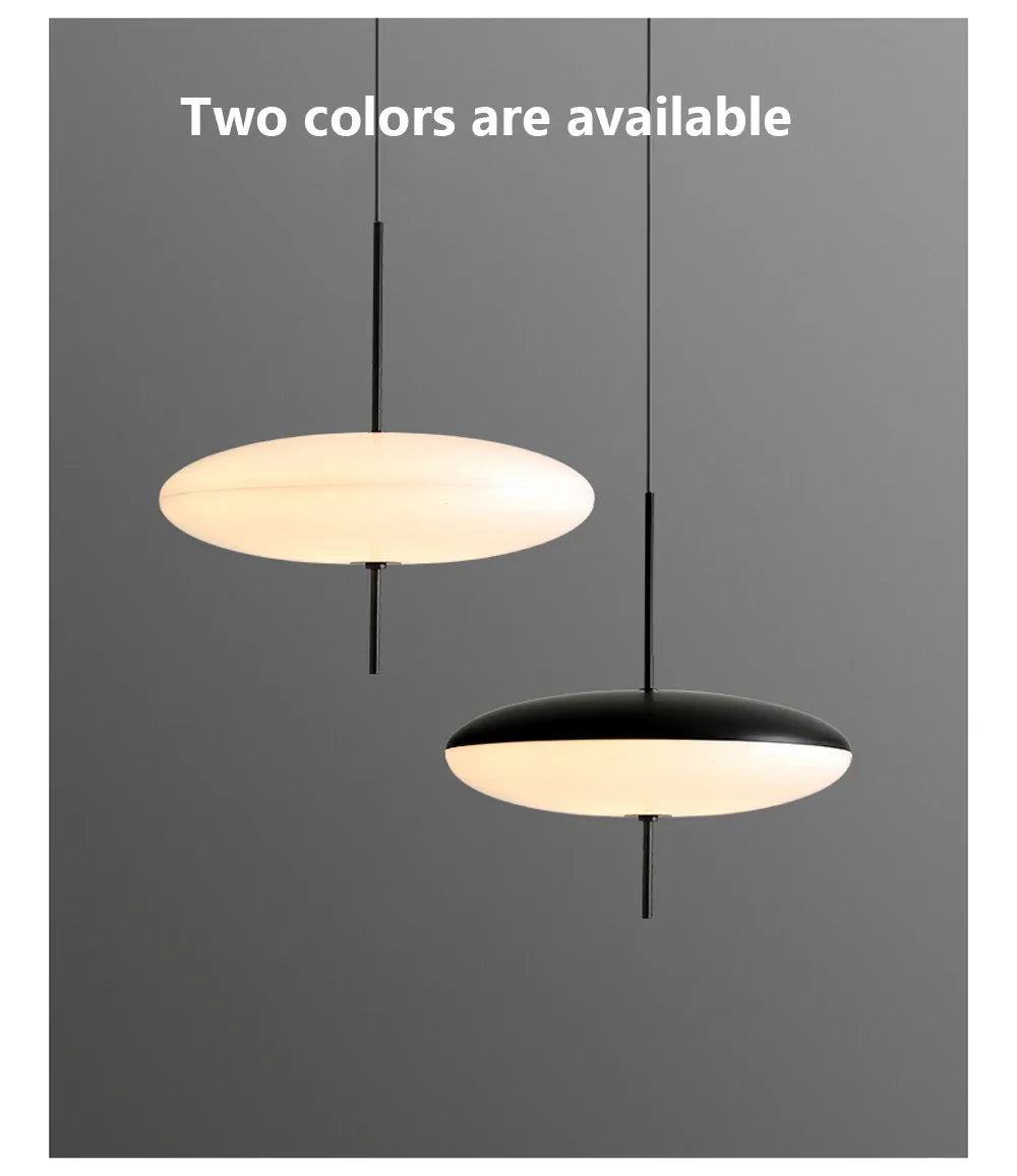 Nordic flying saucer LED pendant light hanging in a modern living room with minimalist décor.