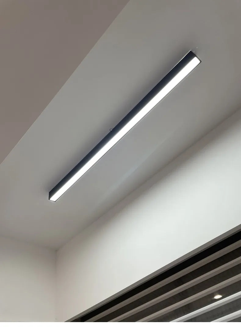 Nordic modern LED ceiling light installed in a contemporary living room with minimalist interior décor.