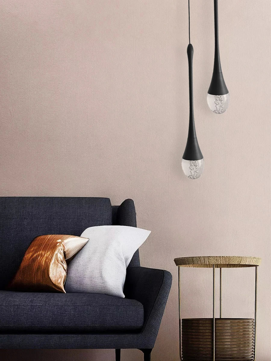 Modern bubble crystal pendant light hanging above a kitchen island in a luxury contemporary home.