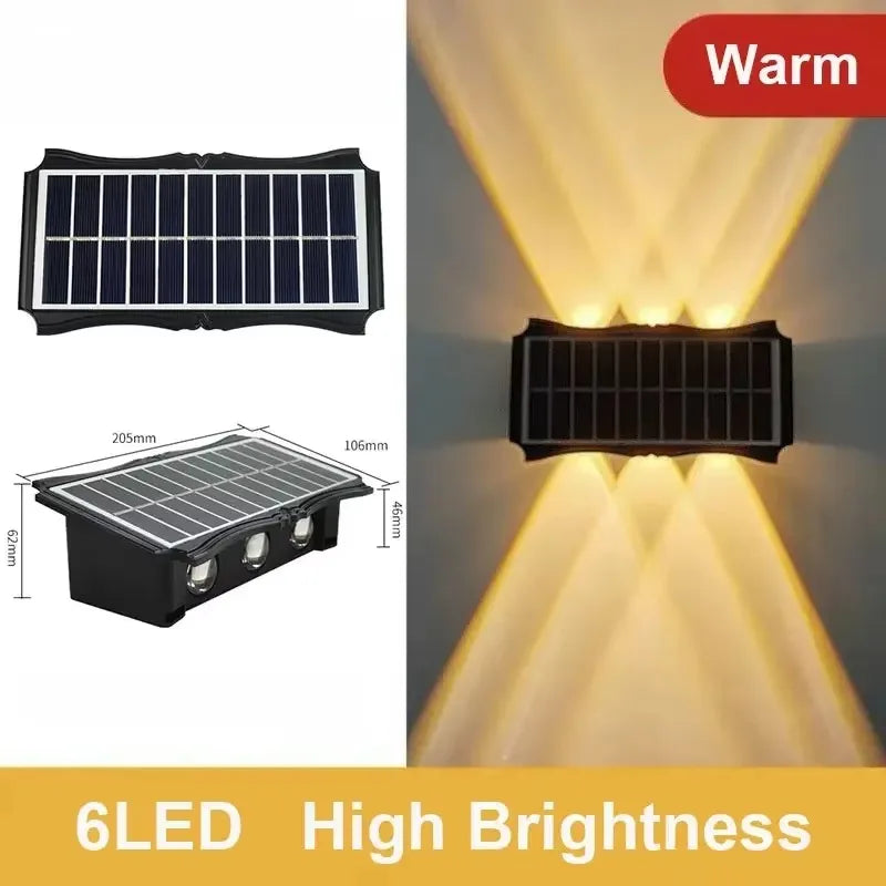 Modern waterproof solar LED wall light installed on an exterior wall illuminating a garden pathway.