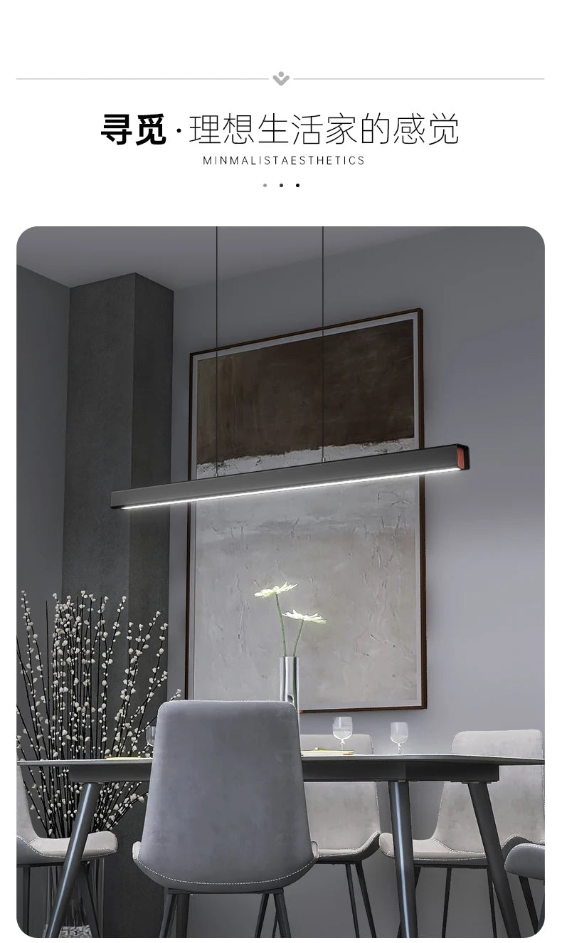 Modern linear LED pendant light suspended above a dining table in a contemporary dining room.