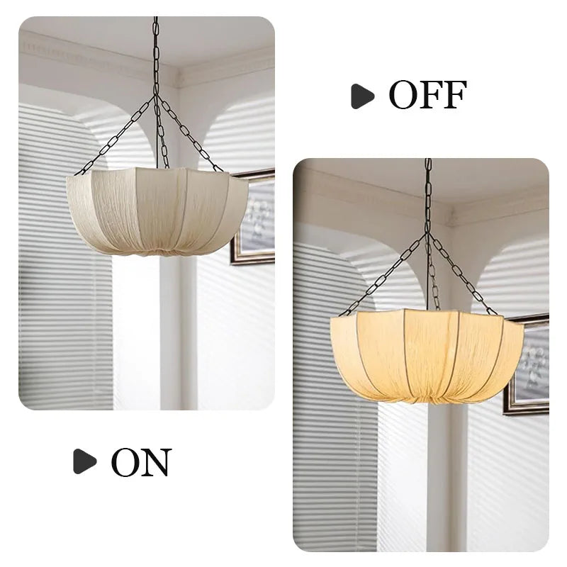 Japanese fabric pendant light with iron chain hanging above a modern dining table in a Japandi-style home.