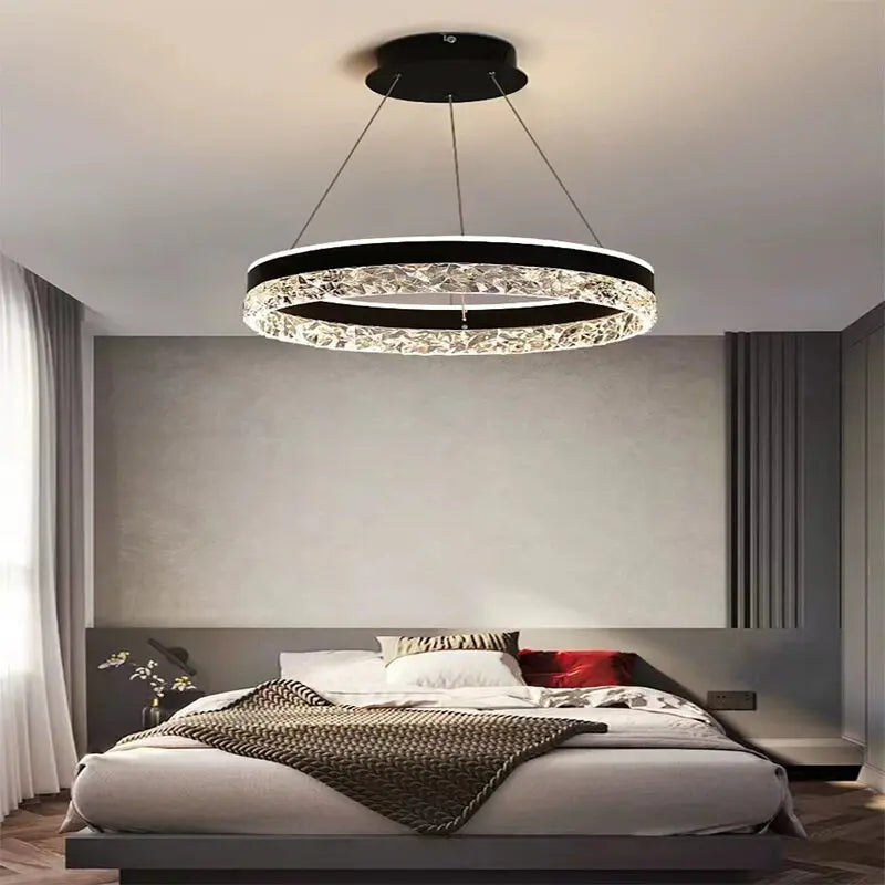 Modern luxe LED ring chandelier suspended in a contemporary living room with elegant minimalist décor.